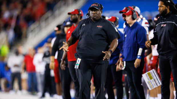 Northern Illinois head coach Thomas Hammock standing on the sidelines.